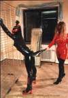 Rubbergirl enjoys her new found Domination