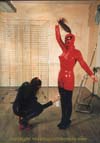 Gummi Kat polishes Rubbergirl